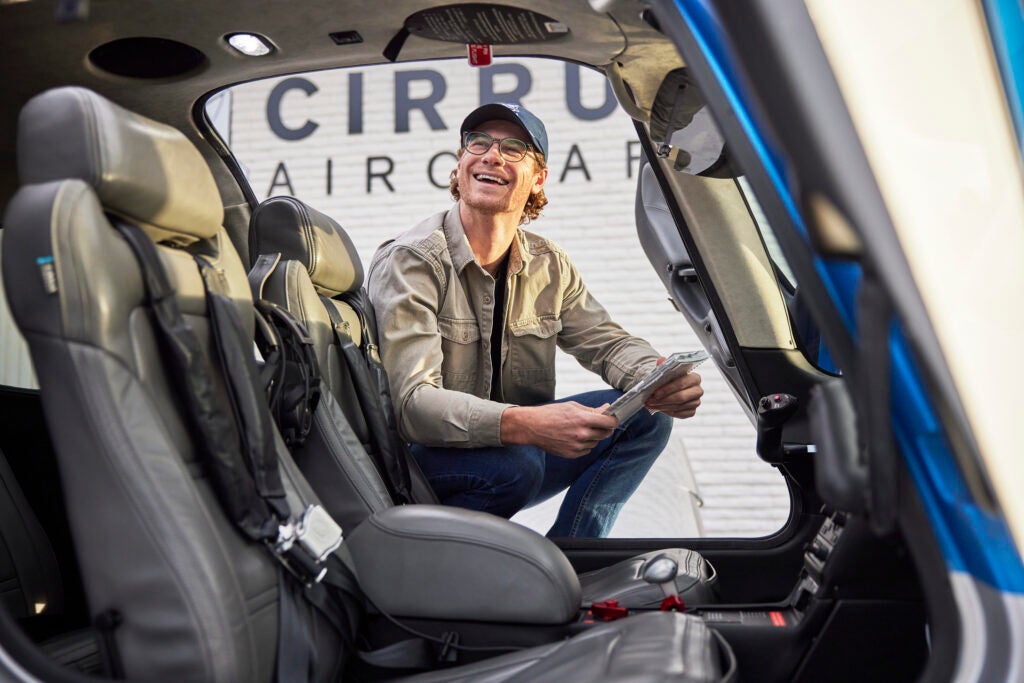 man looking inside aircraft